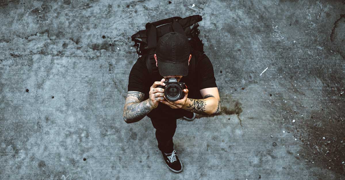 A Photographer holding a camera