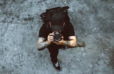 A Photographer holding a camera