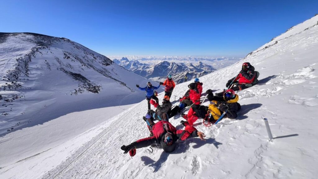 Climbers resting on a snow mountain