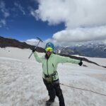 Mountaineer with an Ice Axe on a snow mountain