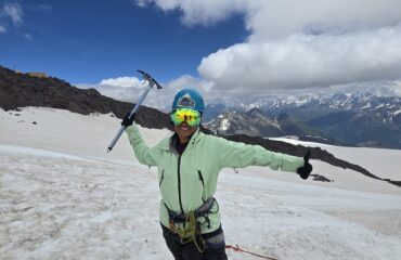 Mountaineer with an Ice Axe on a snow mountain