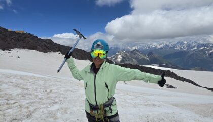 Mountaineer with an Ice Axe on a snow mountain