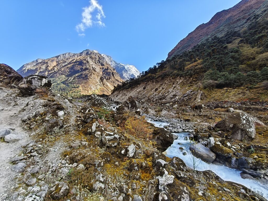 A flowing river with mountains around