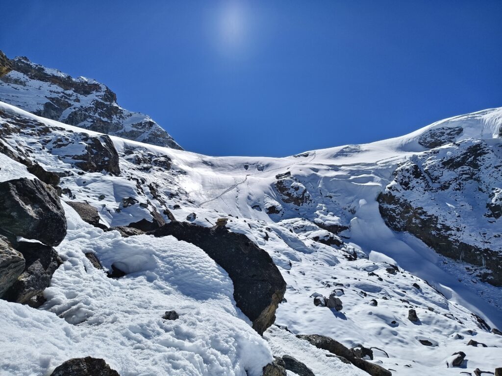 Snow covered boulder areas on the trail to Mera Peak high camp in Nepal.
