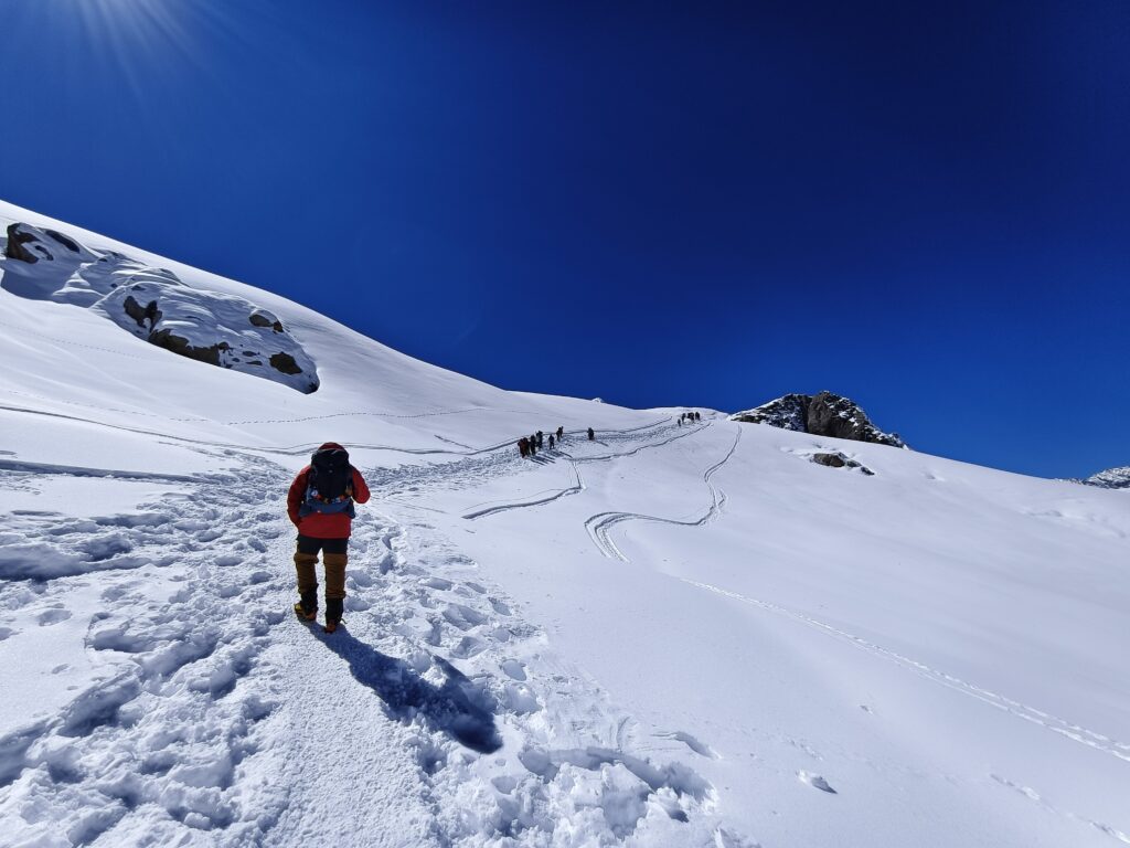 A climber walking on the snow field on Mera Peak in Nepal.