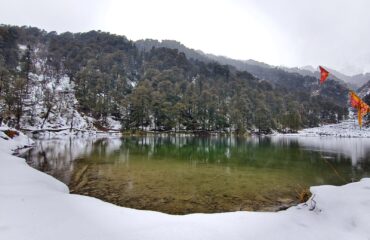 Dodital Lake surrounded by snow cover landscape and trees