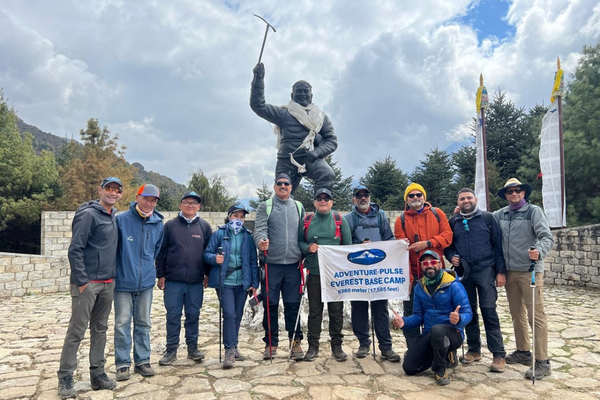 Everest Base Camp Trek group posing with Himalayan mountains in Nepal