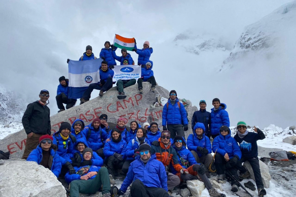Large group of trekkers celebrating Everest Base Camp Trek in Nepal